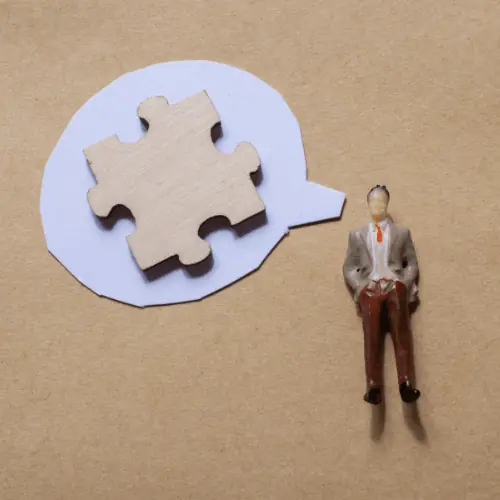Miniature figures holding protest signs